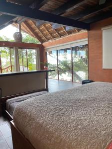 En eller flere senger på et rom på Xoot KaAna villa Amanecer