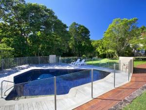 a swimming pool with a fence around it at Little Cove Townhouse 2 Pandanus Street 14 in Noosa Heads