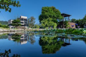 a pond with lily pads on the water at Tan Villa in Taitung City