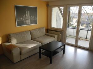 a living room with a couch and a coffee table at Apartment Yvonne in Eimeldingen