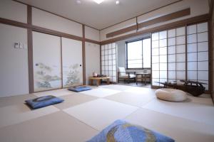 a room with two meditation mats on a tiled floor at Daigo - Vacation STAY 07990v in Kanayama