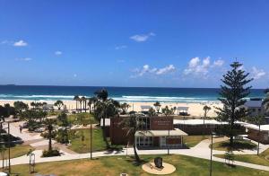 a view of the beach and the ocean from a resort at Spacious 3 bedroom apartment opposite surf club in Kingscliff