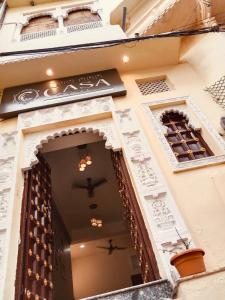 an entrance to a building with a sign on it at Hotel Casa by the lake in Udaipur