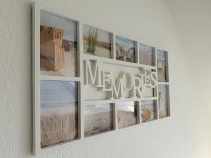 een collage van foto's op een muur met de woorden meos bij Mila am Meer in Neuharlingersiel
