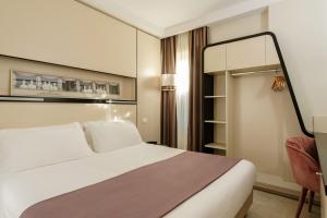 Postel nebo postele na pokoji v ubytování Hotel Smeraldo