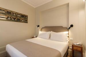 Postel nebo postele na pokoji v ubytování Hotel Smeraldo