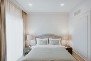 Llit o llits en una habitació de Hotel Divine Park
