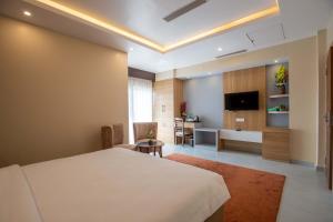 TV a/nebo společenská místnost v ubytování Hotel Palm International