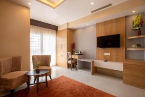 TV a/nebo společenská místnost v ubytování Hotel Palm International