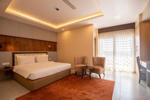 Postel nebo postele na pokoji v ubytování Hotel Palm International