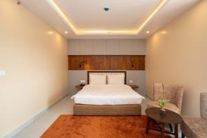 Postel nebo postele na pokoji v ubytování Hotel Palm International