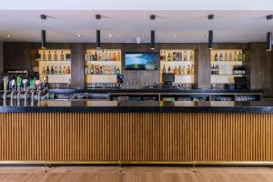 a bar in a restaurant with a counter top at Glashaus Hotel in Tallaght