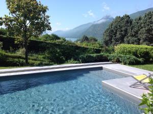 a swimming pool with a view of a mountain at Au petit Nice in Brison-Saint-Innocent