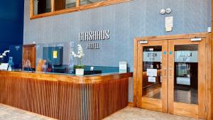 a restaurant with a checkout counter in a building at Glashaus Hotel in Tallaght