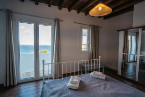 Postel nebo postele na pokoji v ubytování Cape Napos + 37 fotografií
