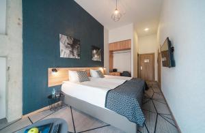 Postel nebo postele na pokoji v ubytování Amarant Urban Hotel & Conference Center by CHM + 37 fotografií
