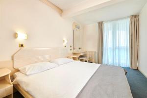 Postel nebo postele na pokoji v ubytování Hotel Gran Vista Plava Laguna
