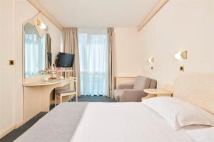 Postel nebo postele na pokoji v ubytování Hotel Gran Vista Plava Laguna