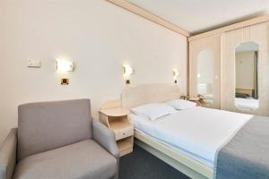 Postel nebo postele na pokoji v ubytování Hotel Gran Vista Plava Laguna