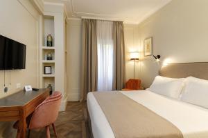Postel nebo postele na pokoji v ubytování Hotel Smeraldo
