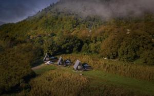 an aerial view of a group of cabins in a mountain at HAERI • Utsera Cabins • Racha in Utsera