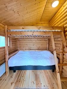 Postel nebo postele na pokoji v ubytování Sarkkila