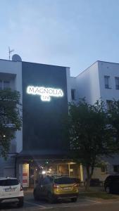 aania sign on the side of a building at Ośrodek Rehabilitacyjno-Wczasowy Magnolia in Kołobrzeg
