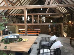 a patio with a table and chairs in a room at LINDE2 in Horperath