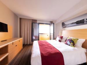 Aparthotel Adagio Toulouse Centre Ramblas客房内的一张或多张床位
