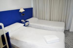 Postel nebo postele na pokoji v ubytování Hotel Vila-real Azul