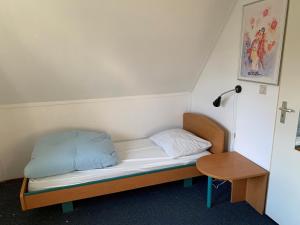Postel nebo postele na pokoji v ubytování Kustverhuur, Park Schoneveld, Zeemeeuw 164