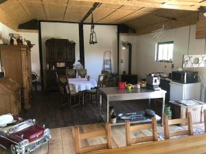 a kitchen and dining room with a table and chairs at B&B Neuses am Brand in Sonnefeld