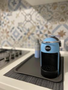 a toaster sitting on top of a kitchen counter at Rosa Dei Venti Apartment in Catania