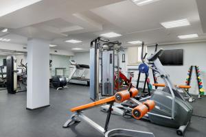 a gym with cardio equipment in a room at Hotel Lime Krasnoselskaya in Moscow