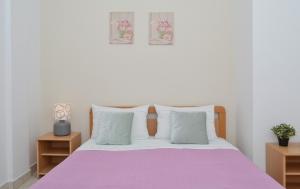 Ένα ή περισσότερα κρεβάτια σε δωμάτιο στο Apartments Nina