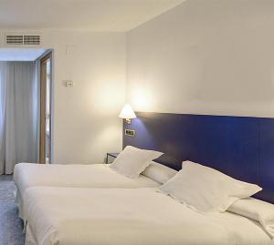 Postel nebo postele na pokoji v ubytování Hotel Vila-real Azul