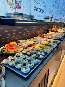 a buffet line with many different types of food at SlowDown Travemünde in Travemünde