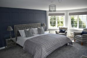 Un pat sau paturi într-o cameră la Rockstone Cottage