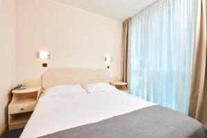 Postel nebo postele na pokoji v ubytování Hotel Gran Vista Plava Laguna