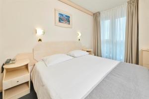 Postel nebo postele na pokoji v ubytování Hotel Gran Vista Plava Laguna