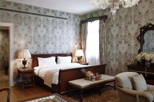 Ένα ή περισσότερα κρεβάτια σε δωμάτιο στο Albergo Hotel