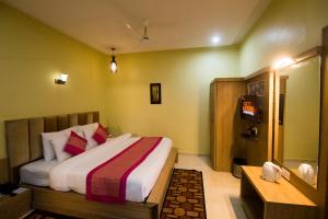 A bed or beds in a room at The River Front Resort