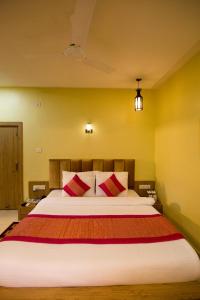 A bed or beds in a room at The River Front Resort