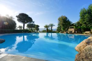 The swimming pool at or close to Hôtel Marina Corsica