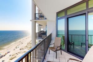 a balcony with a view of the beach at Phoenix West II in Orange Beach