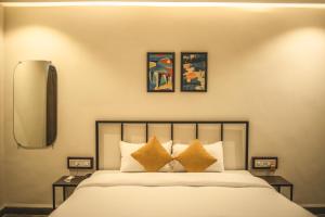 Säng eller sängar i ett rum på Amber Rooms