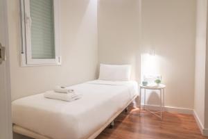 Tempat tidur dalam kamar di Vibe Apartments by Olala Homes