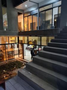 a person walking up the stairs of a building at Vita Mountain Lodge in Santa Lucía