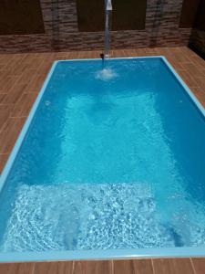 Πισίνα στο ή κοντά στο Ótima casa de praia com piscina