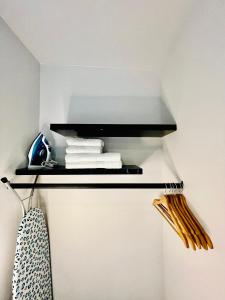 a shelf in a room with towels on it at L'Atelier des bords de l'Eure in Chartres